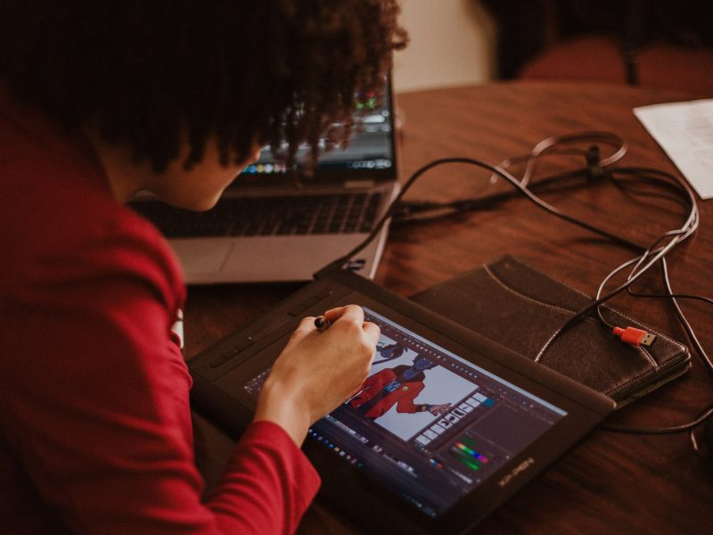 Makayla, one of the first PQC Trains students to earn a Toon Boom certification, works on the digital drawing pad.