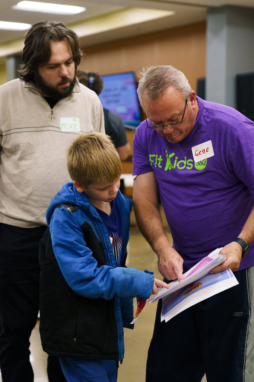 A Parkview Expert works with a child and his guardian in the FitKids360 program on an activity.