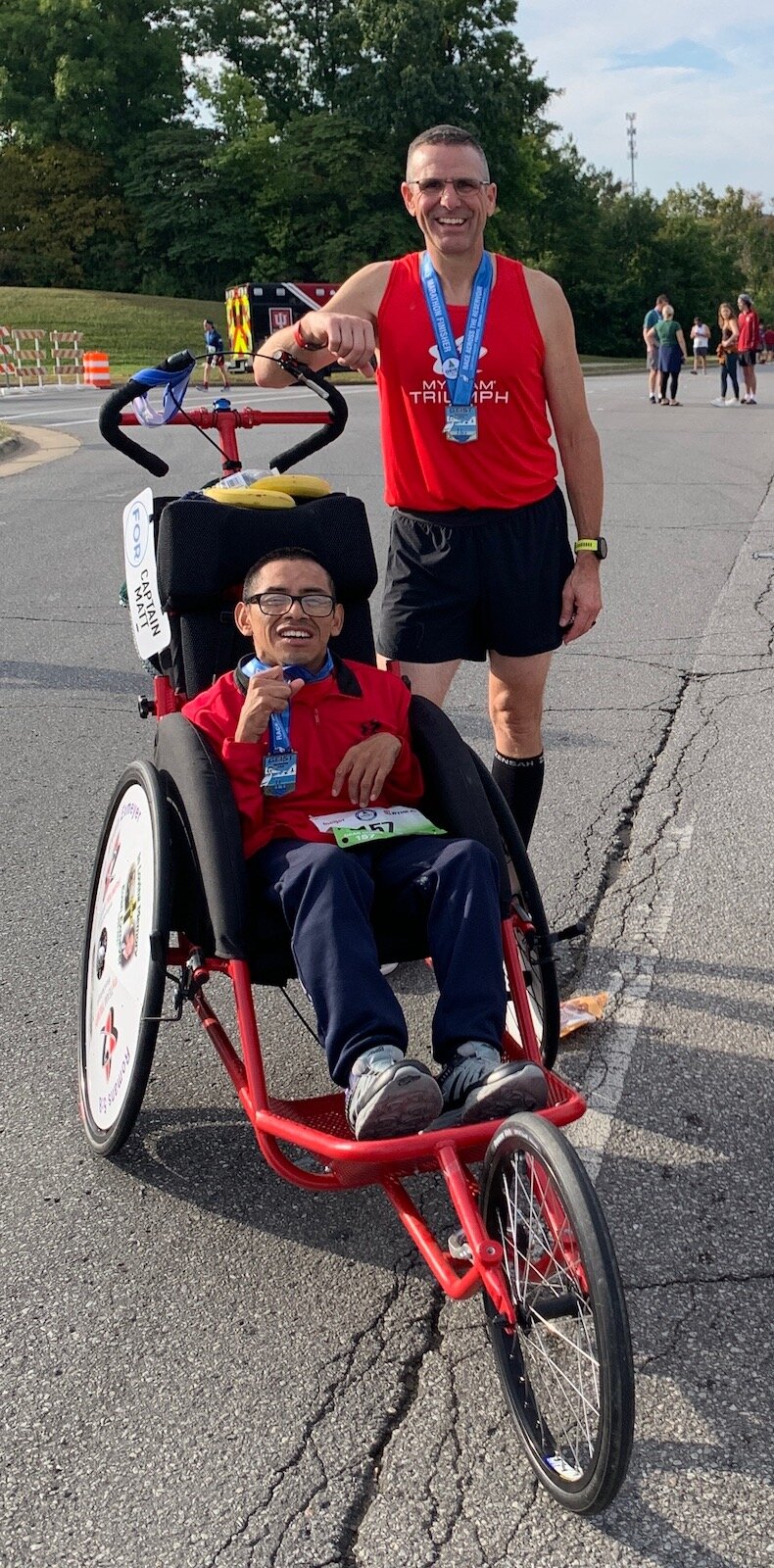 Todd Schindler and his Captain Matt after a half marathon.