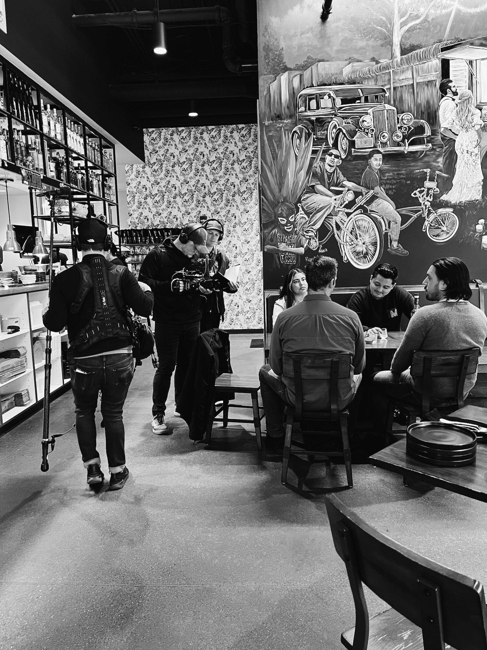 Perez filming "Mise & Place", a series focused on the intersection of food and culture, at Mercado.