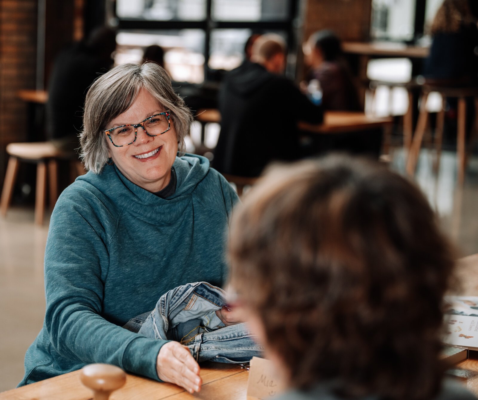 Mia Morris, left, talks with fellow group member Jennie Renner during Monday Mendings.