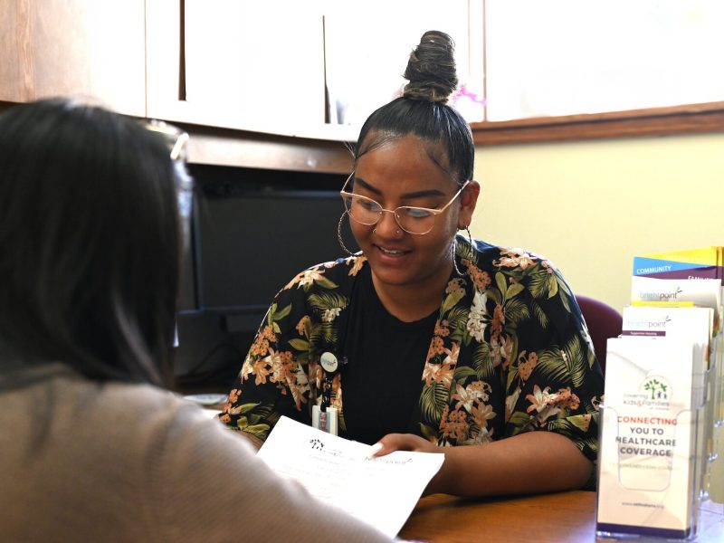 A Brightpoint Health Coverage Navigator helping a client.