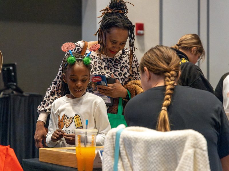 While walking through the Girl Scouts' STEM Expo, attendees see interactive demos and speak with women who work in STEM.