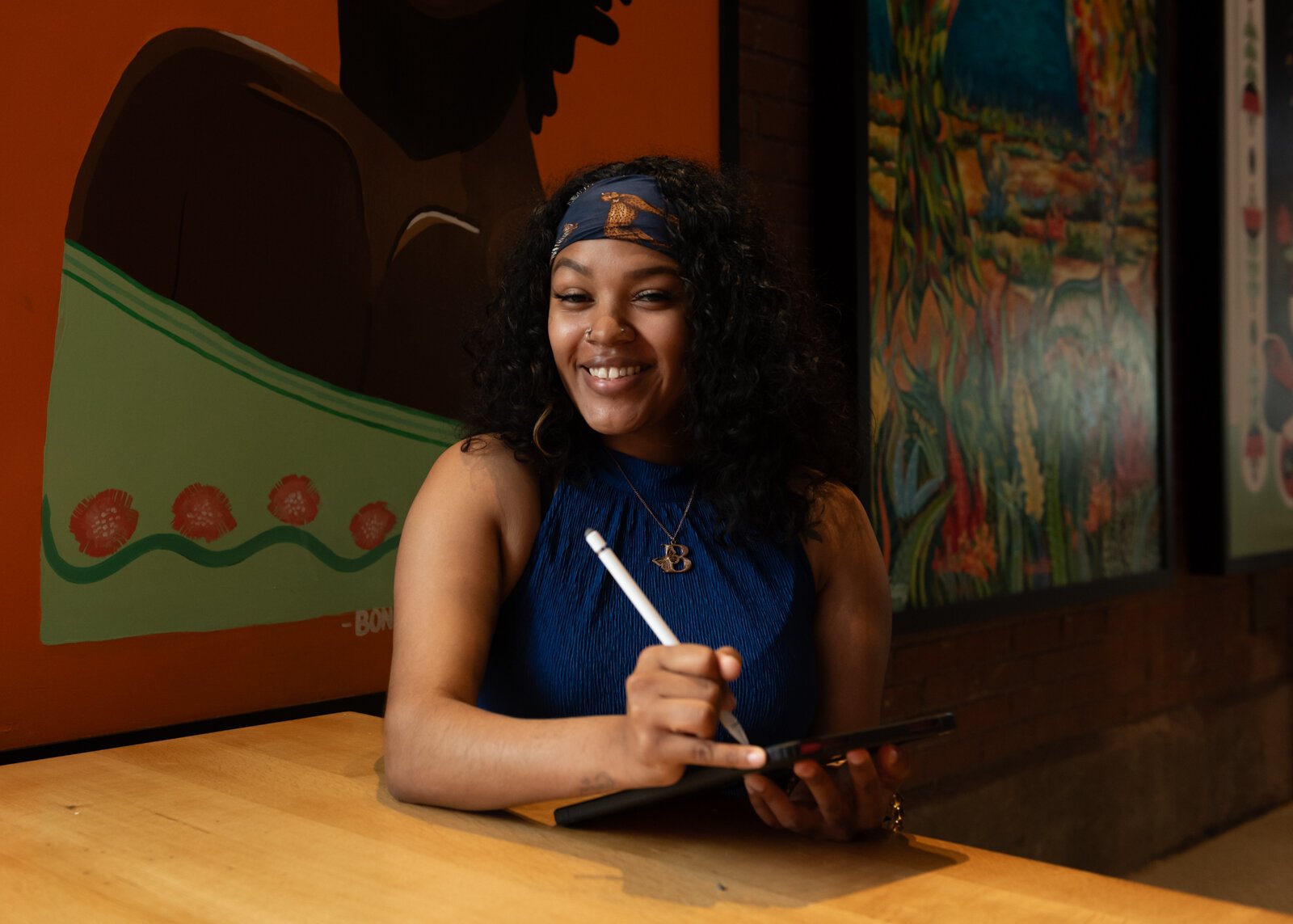 Artist BonJo sketches on her iPad.