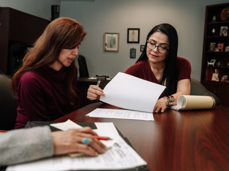 Luz Ostrognai with Catholic Charities demonstrates what a meeting with immigration clients would look like at the Archbishop Noll Catholic Center.