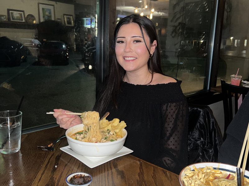 Eat With Bella at Bangkok Bistro enjoying the curry noodle soup.