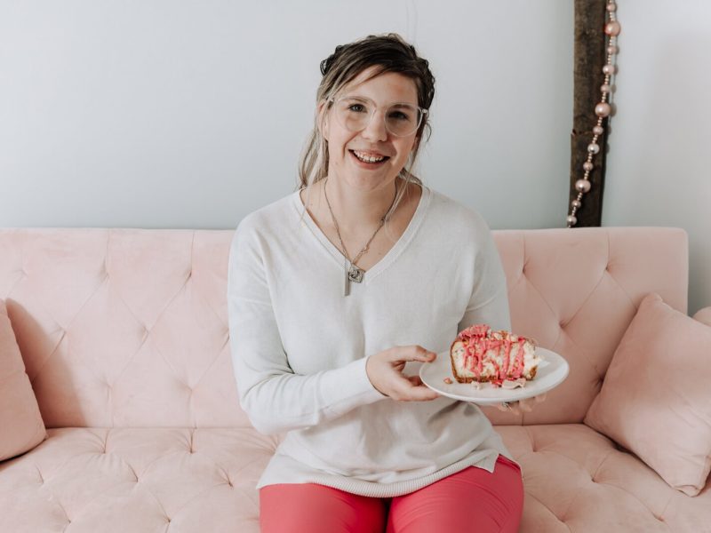 Owner and founder Grayce Holloway holds the frosted animal cookie cheesecake at Icing for Izaac, 243 Airport North Office Park, Fort Wayne, IN 46825.