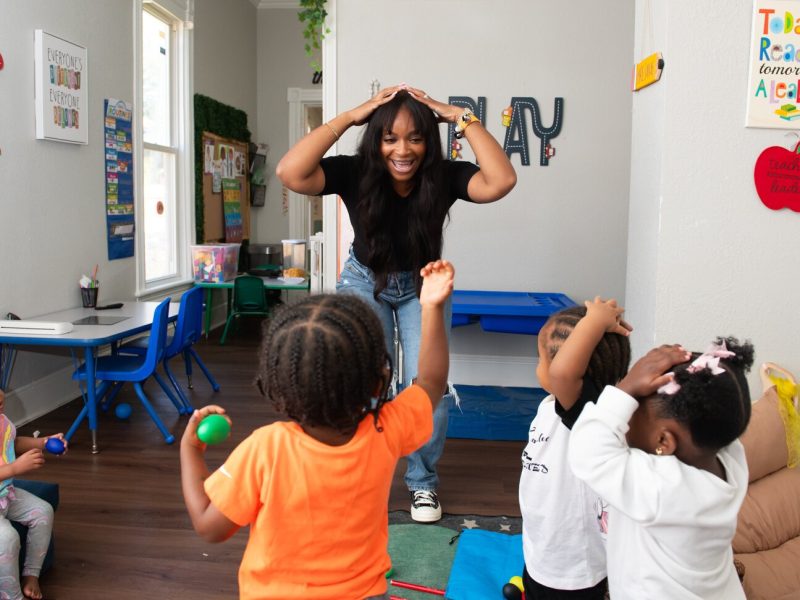 Janae Dubose, owner of Little Achievers Home Daycare Kindergarten Prep,  leads Circle Time featuring songs and music with her students.