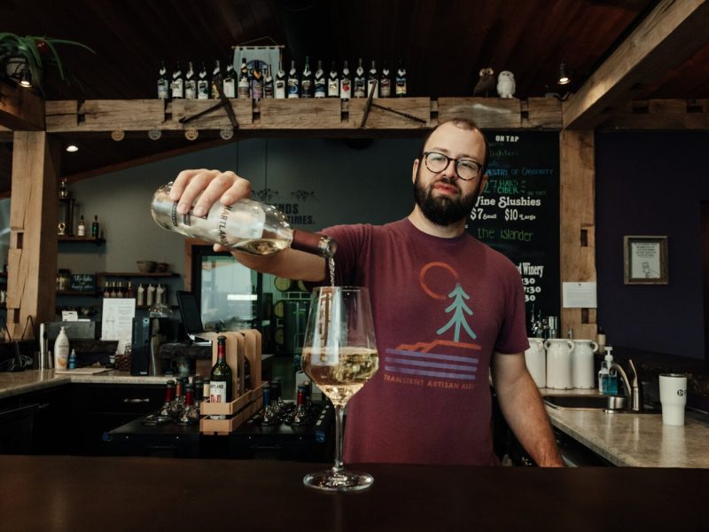 inemaker Kirk Etheridge pours an estate grown Lacrescent at Hartland Winery in Ashley, IN.