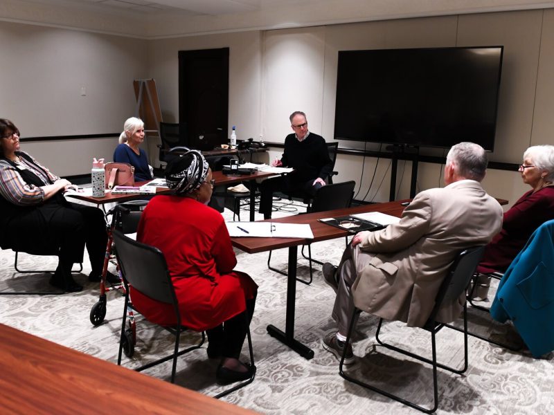 Members of the Mayor's Age-Friendly Council discuss issues during their meeting at Citizen's Square.