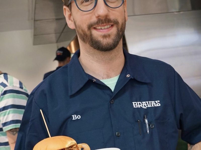 Bo Gonzalaz, owner of Bravas, serving a Dave's Not Here, Man Burger at the new restaurant on Fairfield Avenue.