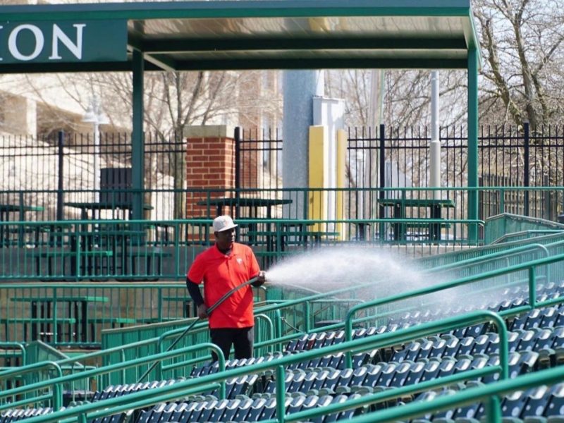 Parkview Field employees prepare the ballpark for opening day.
