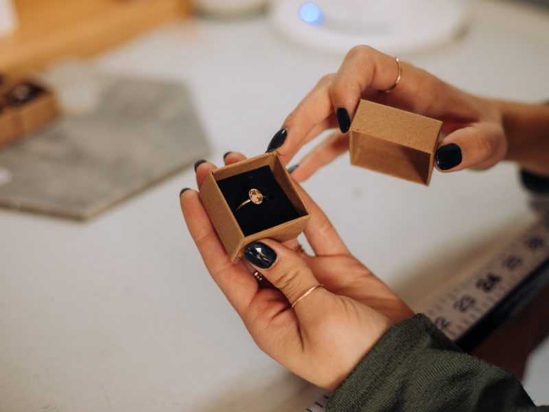 Owner Raelyn Bever holds a finished ring from Still Remains Jewelry.
