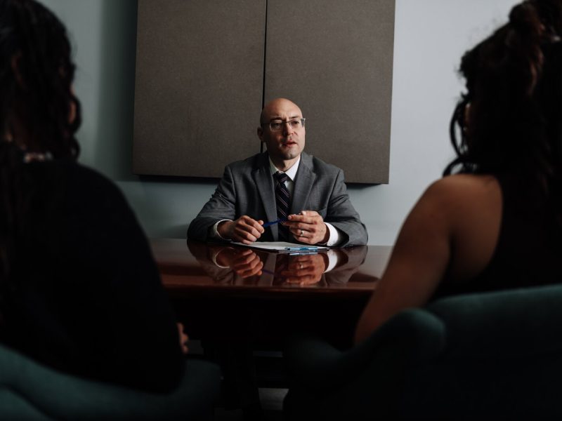 Immigration lawyer Brian A. Seyfried demonstrates what the initial meeting looks like with a new client using staff members at his office the Law Office of Brian A. Seyfried.