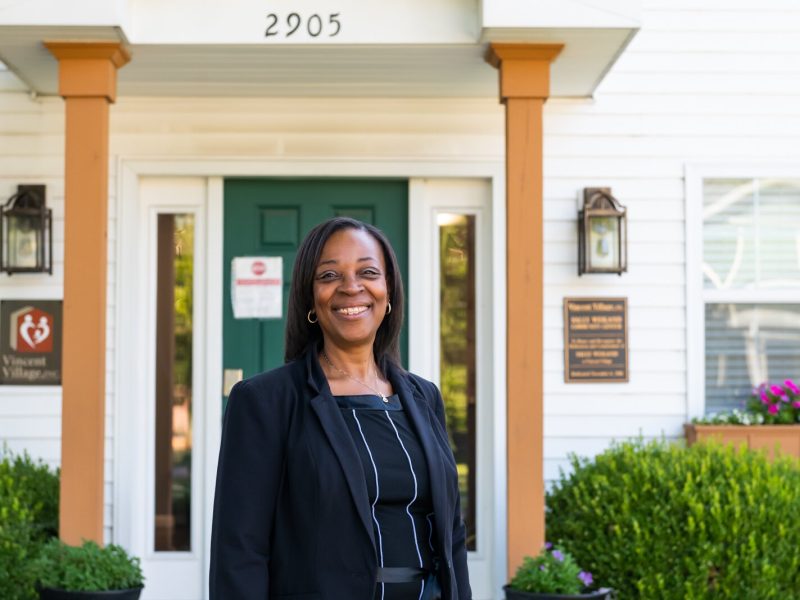 Sharon Tucker, Executive Director of Vincent Village, in front of the Sally Weigand Community Center.