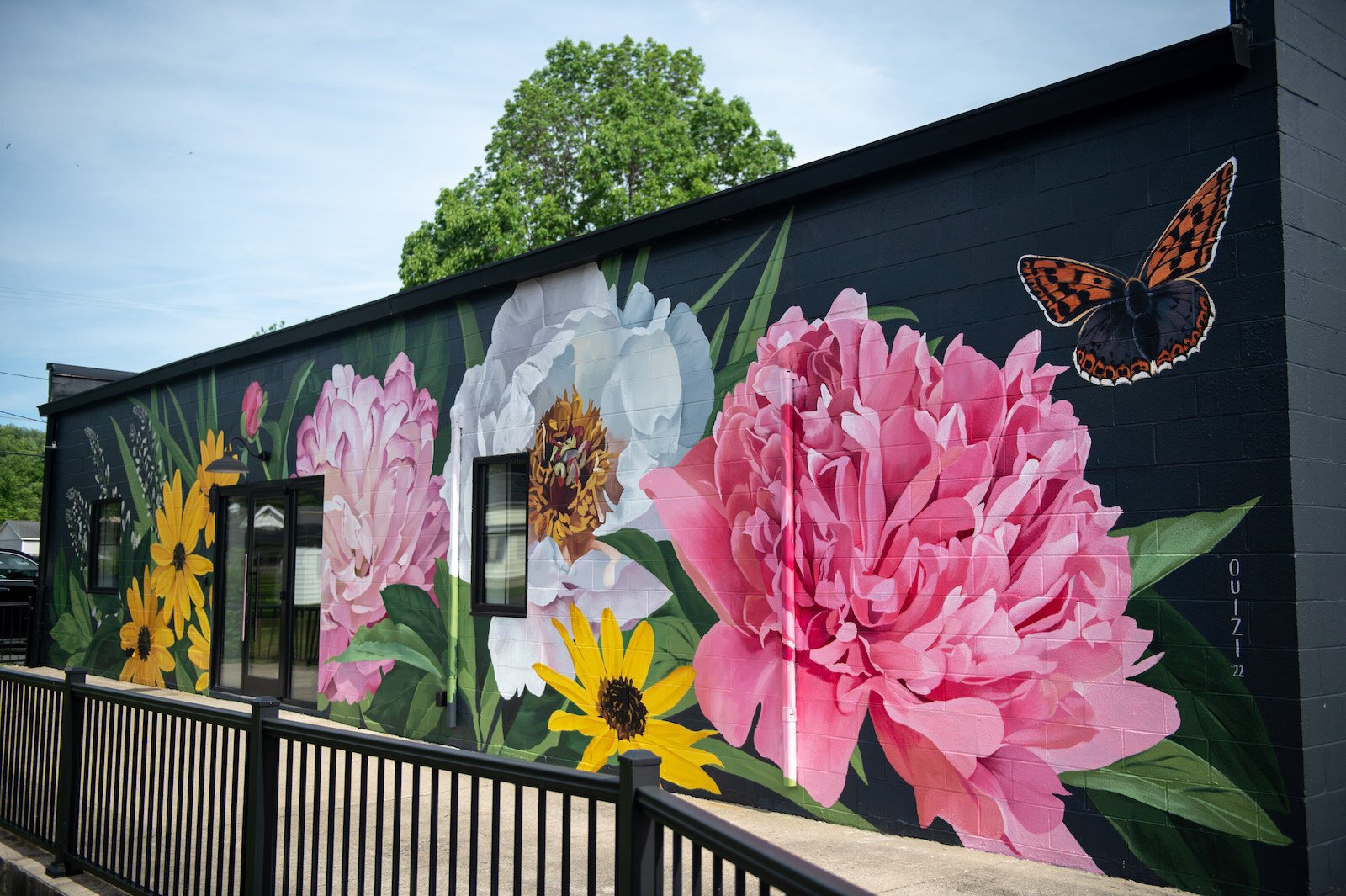 Muralist Louise 'Ouizi' Jones painted the side of Reusser, a digital agency located at 150 S. Main St. in Roanoke.