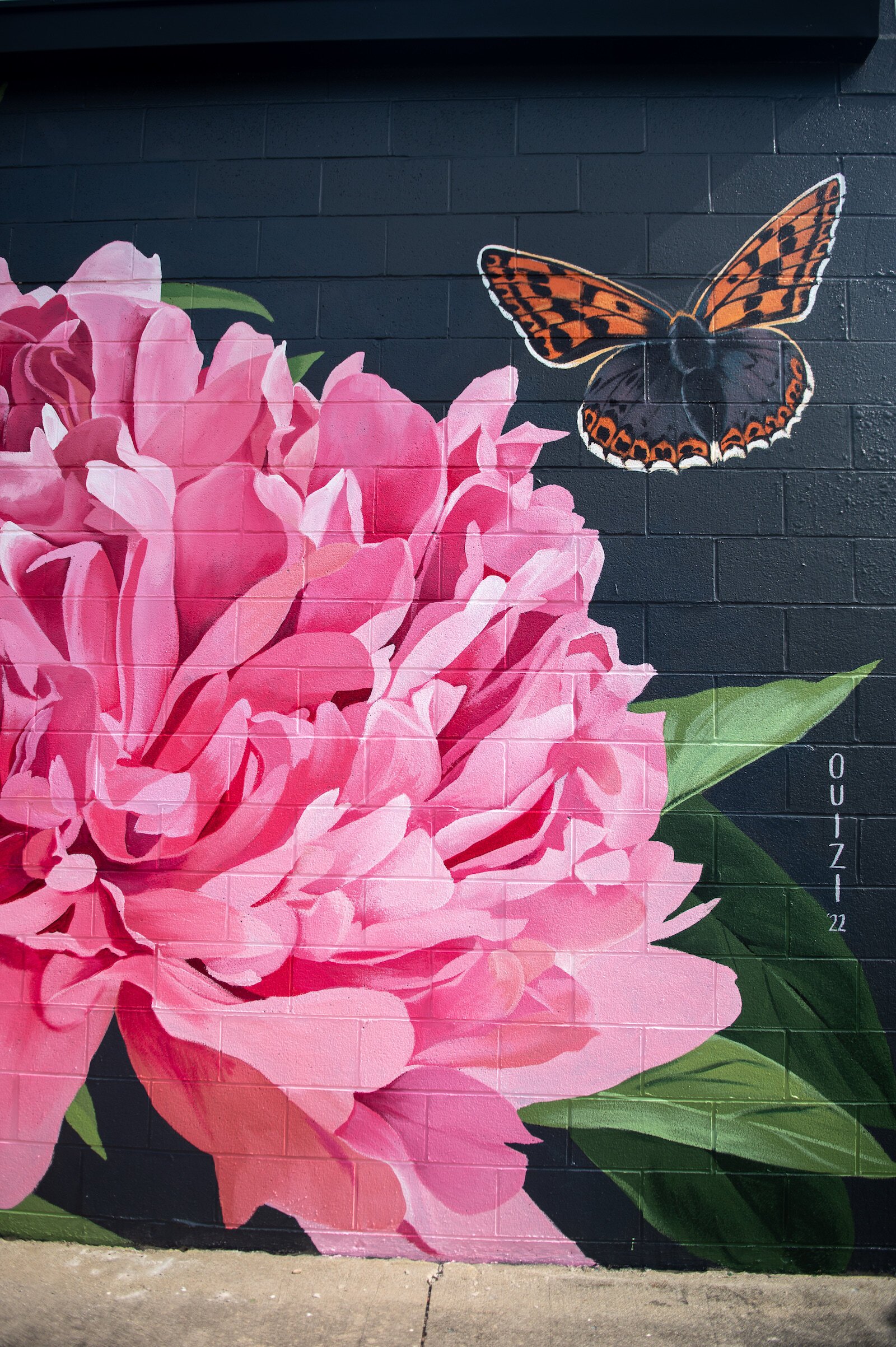 Muralist Louise 'Ouizi' Jones painted the side of Reusser, a digital agency located at 150 S. Main St. in Roanoke.