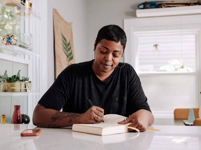 Creative Writer Shanel Turner works on writing in one of her favorite workspaces in the kitchen at her home in the '07.