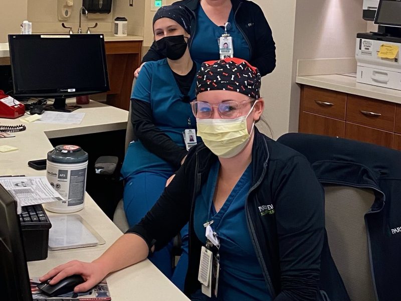 Michaela Weir, pictured in back, is shown during a recent Helping Hands shift with fellow RNs Danielle Gombas, middle, and Kelli Bultemeyer on the ortho trauma unit at Parkview Regional Medical Center.