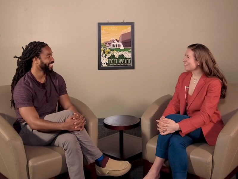 Arts United President Susan Mendenhall (right) talks with Adrian Curry about the significance of Juneteenth.