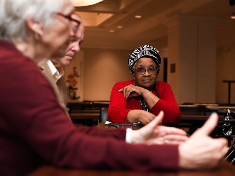 Denise Porter listens to other members during a council meeting with members of the Mayor's Age-Friendly Council at Citizen's Square.
