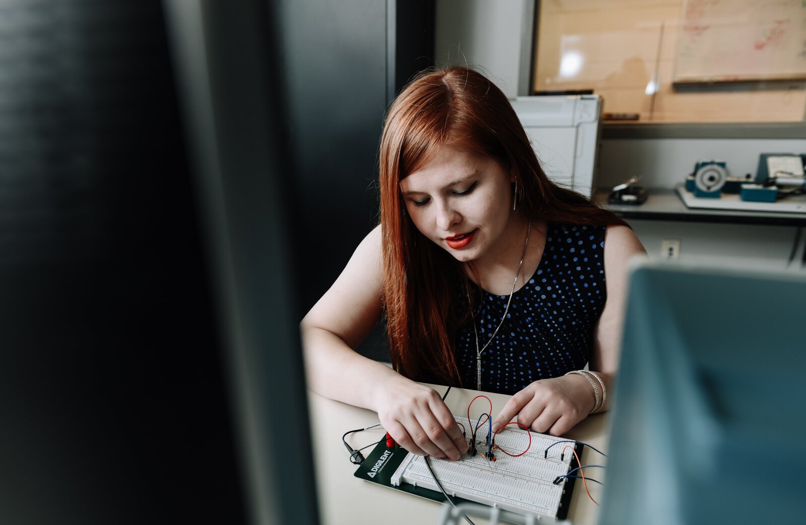 Indiana Tech student Alexandra Forsythe works on operational amplifier functions, specifically a triangle wave generator, in the Talwar College of Engineering and Computer Sciences.