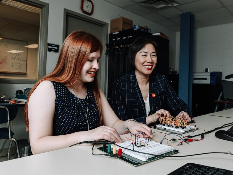Indiana Tech student Alexandra Forsythe, left, and Dr. Ying Shang, Dean of the College of Engineering and School of Computer Sciences work together on operational amplifier functions in the Zollner Engineering Center.