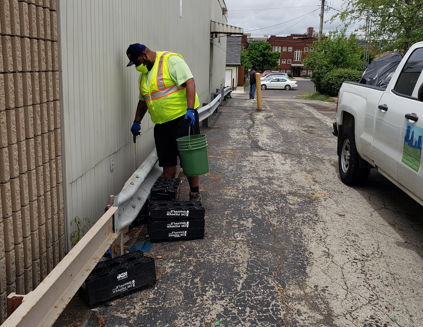 Clean & Green team member Juan Vasquez picks up litter in Downtown Fort Wayne.
