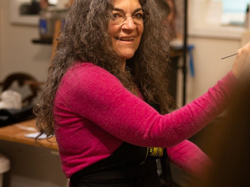 Hilarie Couture, a former street artist, paints in her home studio in Williams Woodland Park of Fort Wayne.