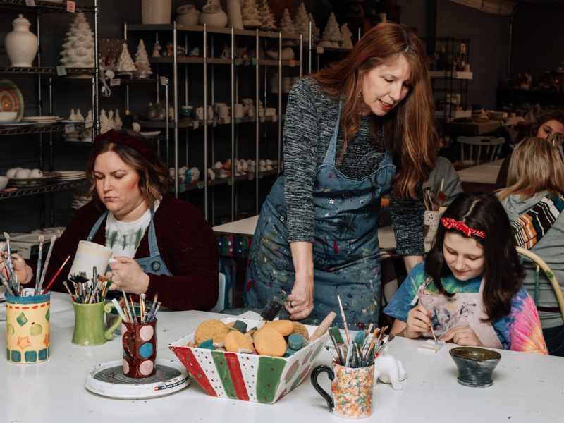 Karen Eilts-Walter, owner, helps customers Emerson Zwiebel, 11, right, and Andrea Zwiebel with their projects at Make It Your Own Art Studio.