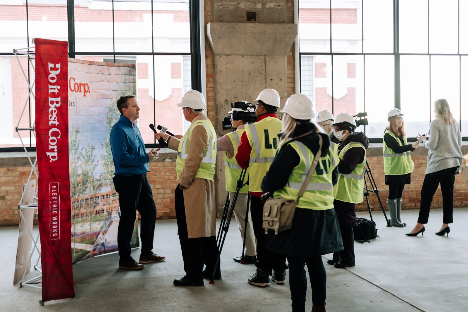 Members of the media question Dan Starr, President and CEO of Do it Best, left, during a media tour of the Do it Best space at Electric Works on December 3, 2021.