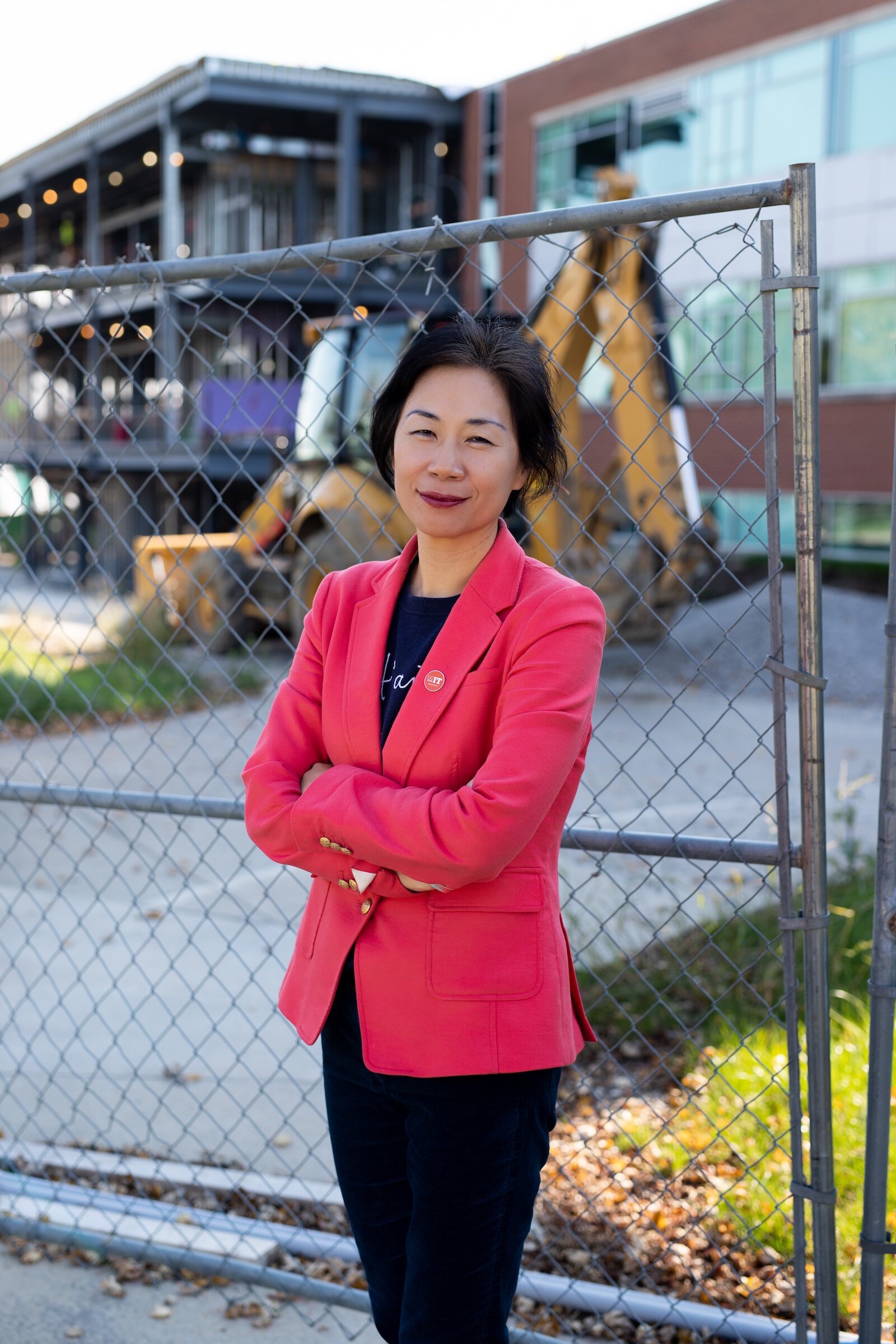 Dr. Ying Dr. Ying Shang stands in front of the Zollner Engineering Center at Indiana Tech, which is under construction to double its size.