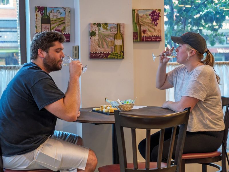 Guests enjoy the Wine & Cheese Bar at the Charley Creek Inn.