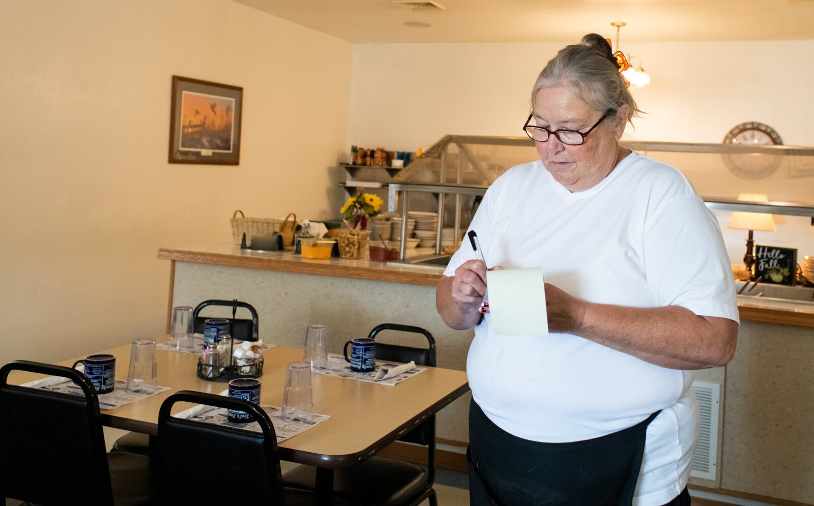 Waitress Kathy Moore takes a customer's order at Teel's Family Restaurant at 108 E. Main St. in Mentone, IN.
