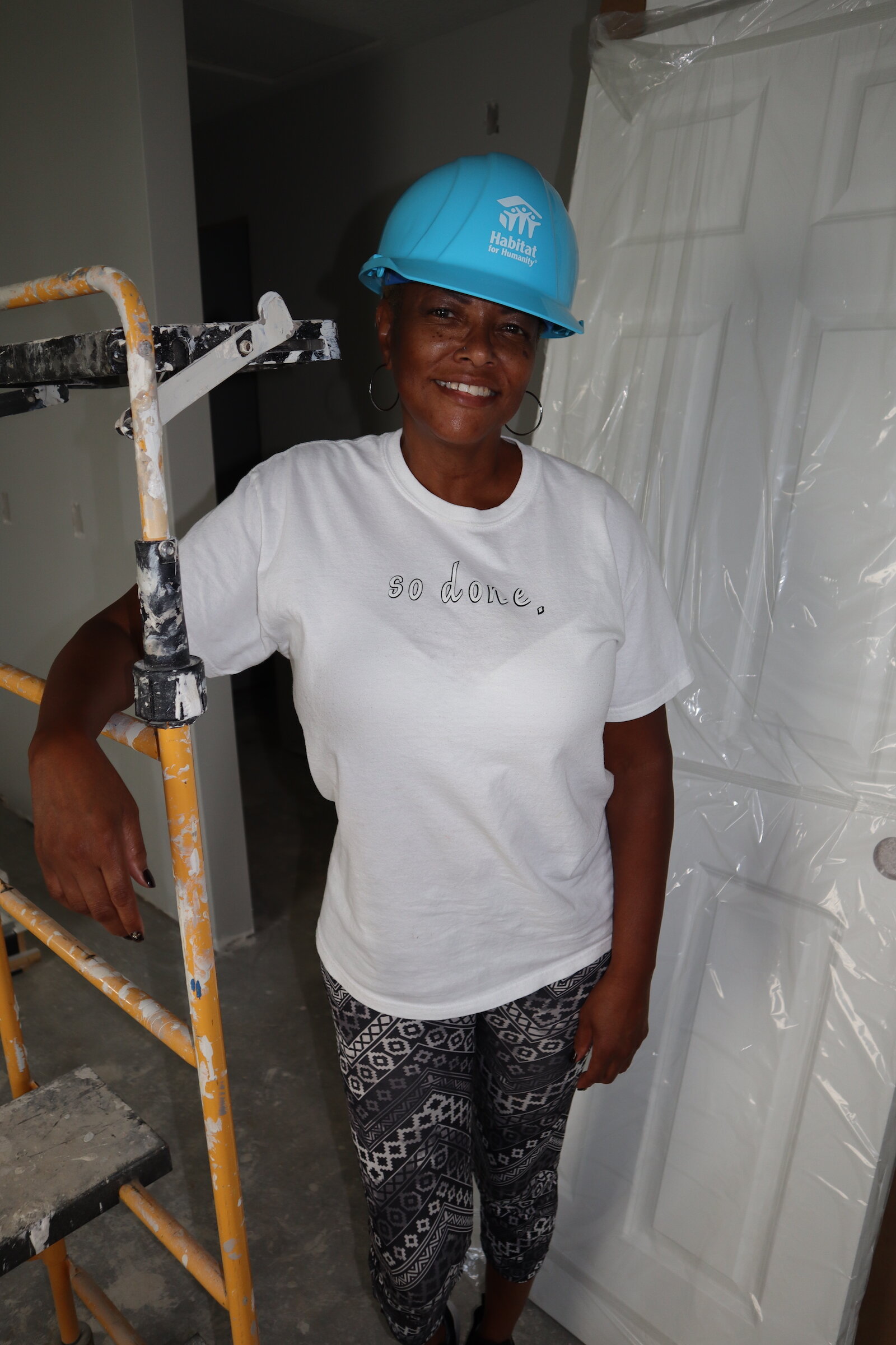 Loretta Taylor helps renovate her home in South East Fort Wayne.
