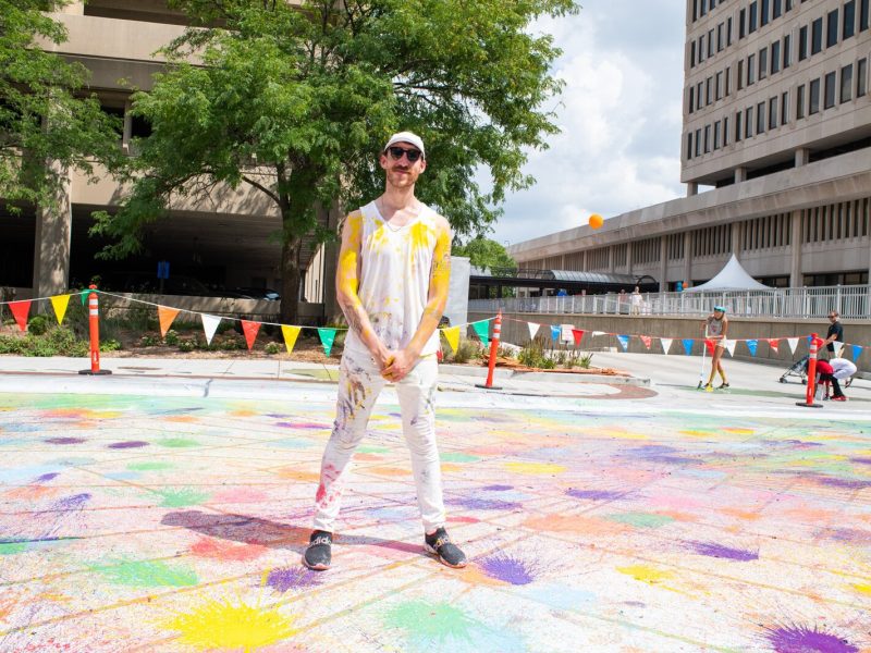 Fort Wayne artist Adam Garland invited the public to help create a new permanent mural downtown with biodegradable, paint-filled water balloons.