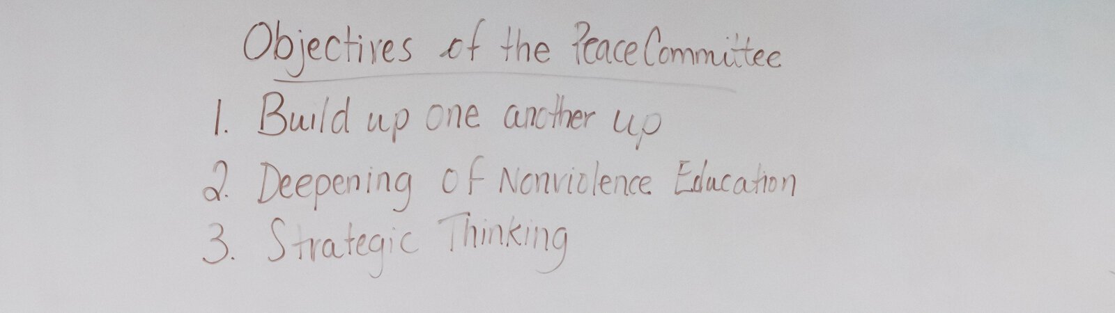 The objectives are written on the whiteboard at The Peacemaker Academy meeting at First Wayne St. United Methodist Church.