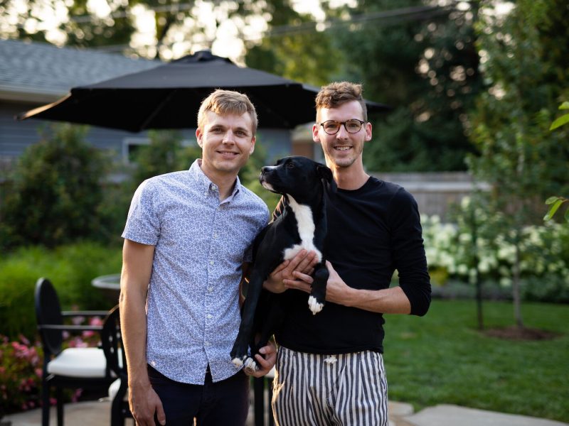 Husbands Kody Tinnel and Cory Allen with their dog Miley.