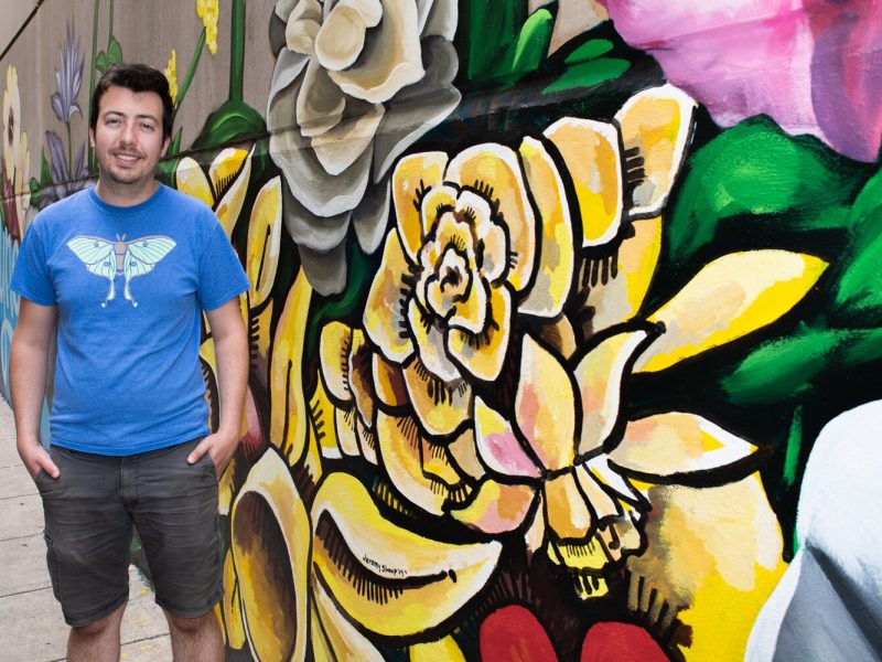 Jeremy Stroup helped artist Shawn Dunwoody with the "Hello" mural in the alley at 120 W. Wayne St. in downtown Fort Wayne.