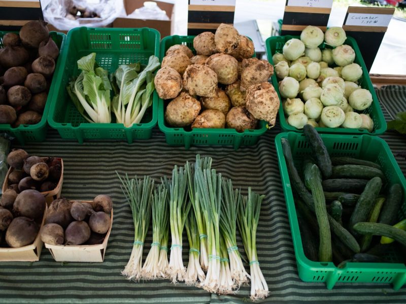 Fresh produce is displayed at the Berry Hill Farm table during the Fort Wayne's Farmers Market at McCulloch Park on Saturday June 19, 2021.