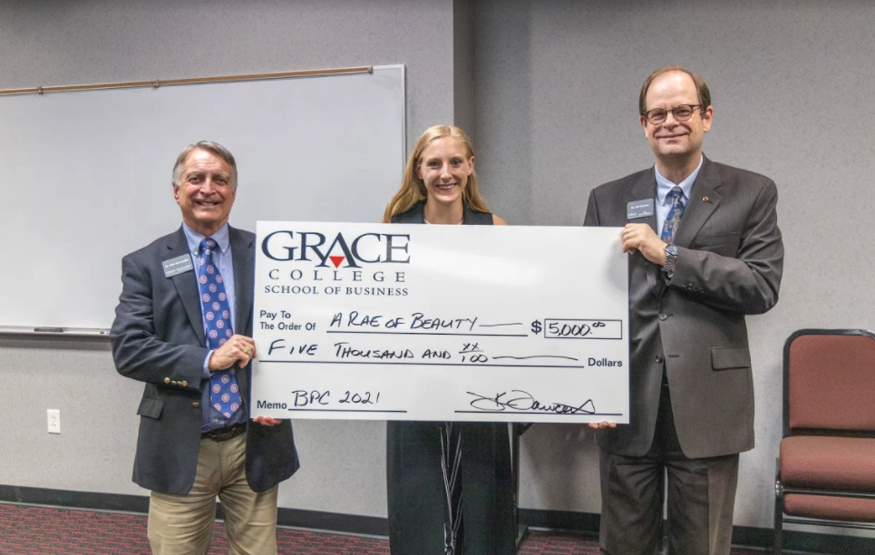 Mackenzie Rae DeLong, center, Founder of A Rae of Beauty and Rae Thrift Boutique.