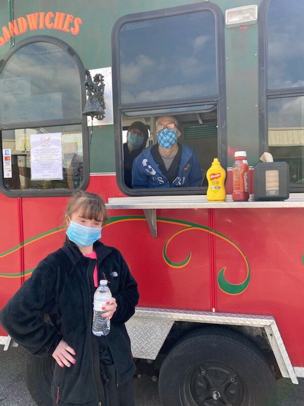 Megan Lock and Steve Mikulski work on the Trolley Food Truck.