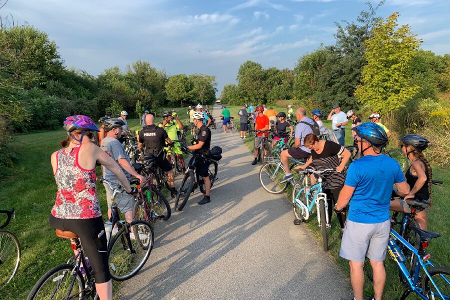 A group of riders chats at Trek the Trails.
