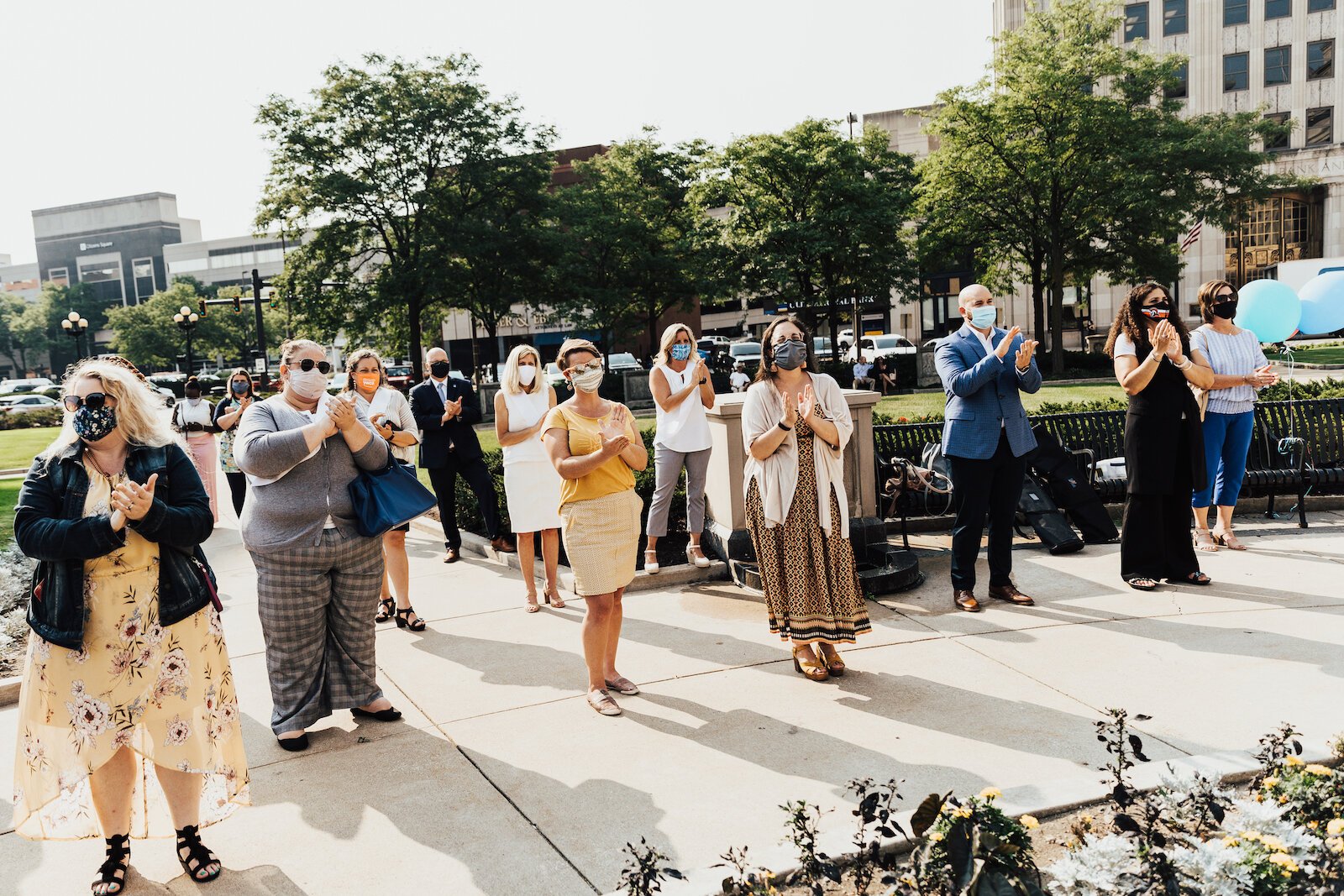 A socially distant crowd gathers at the launch of the Women's Fund in downtown Fort Wayne.