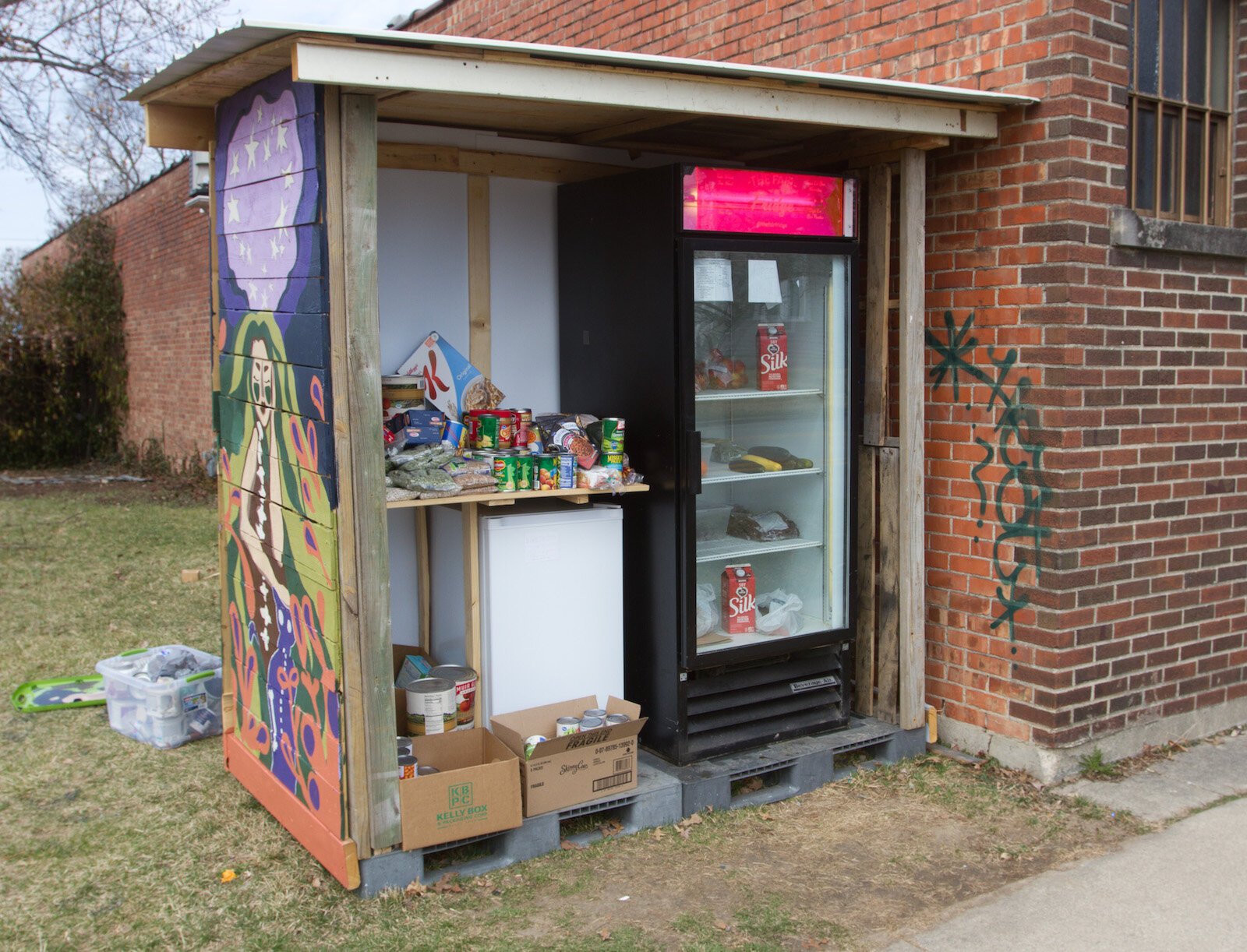 Bloom volunteers with the Fair Fridge in Fort Wayne near Bravas.