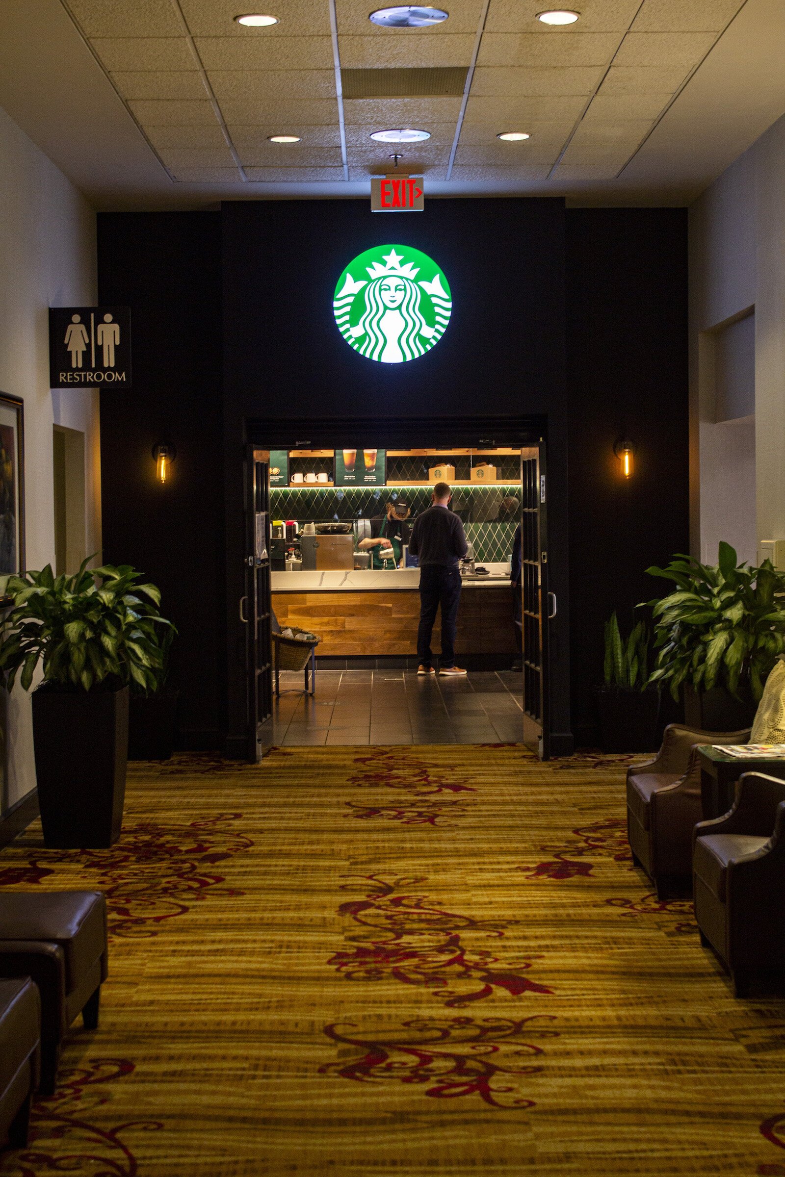 Visitors enjoy the Starbucks inside the Hilton Fort Wayne.