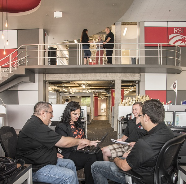 Employees meet at Rural Sourcing's Albuquerque, NM, office.