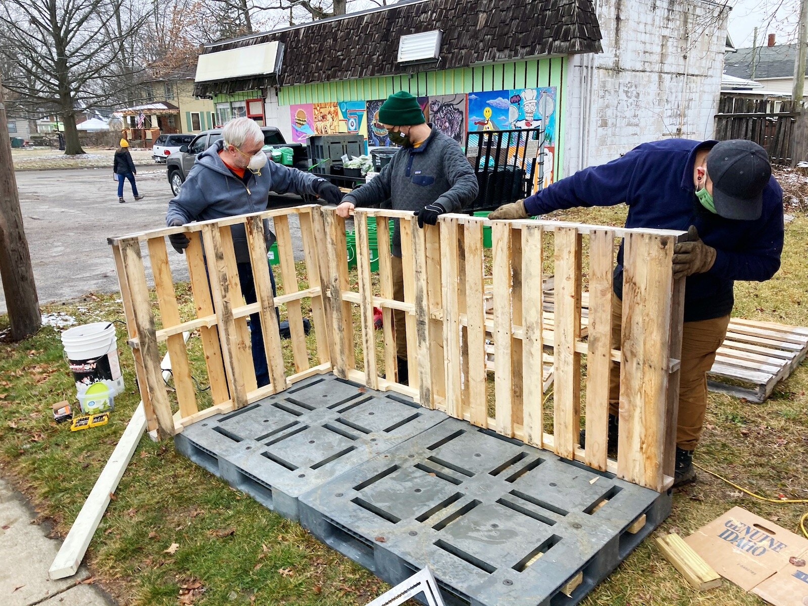 Manuel Gonzalez, Bo Gonzalez, and Brett Bloom build the first Fort Wayne Love Fridge.