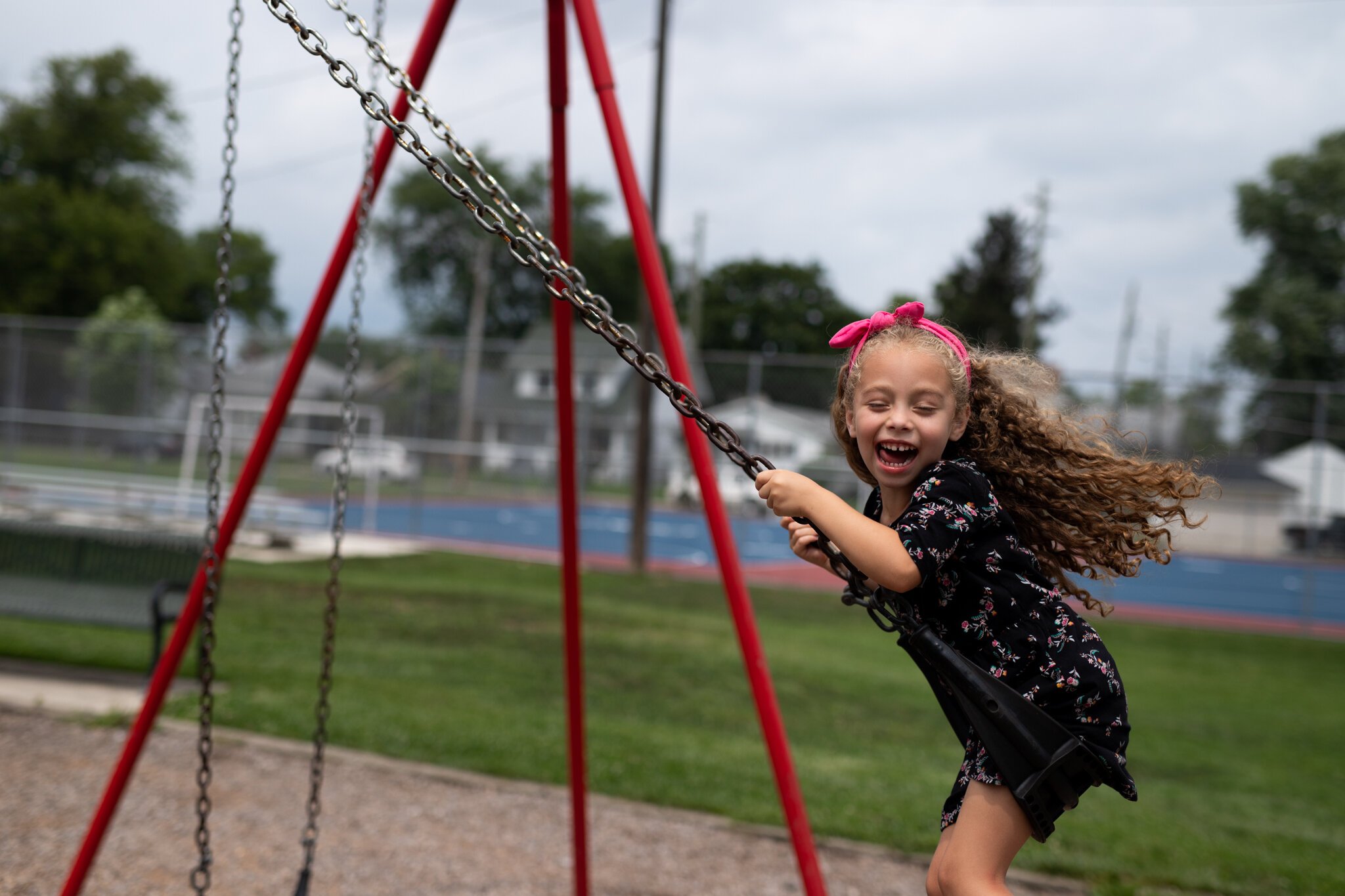 Barnhart's daughter enjoys the swingset at Packard Park.