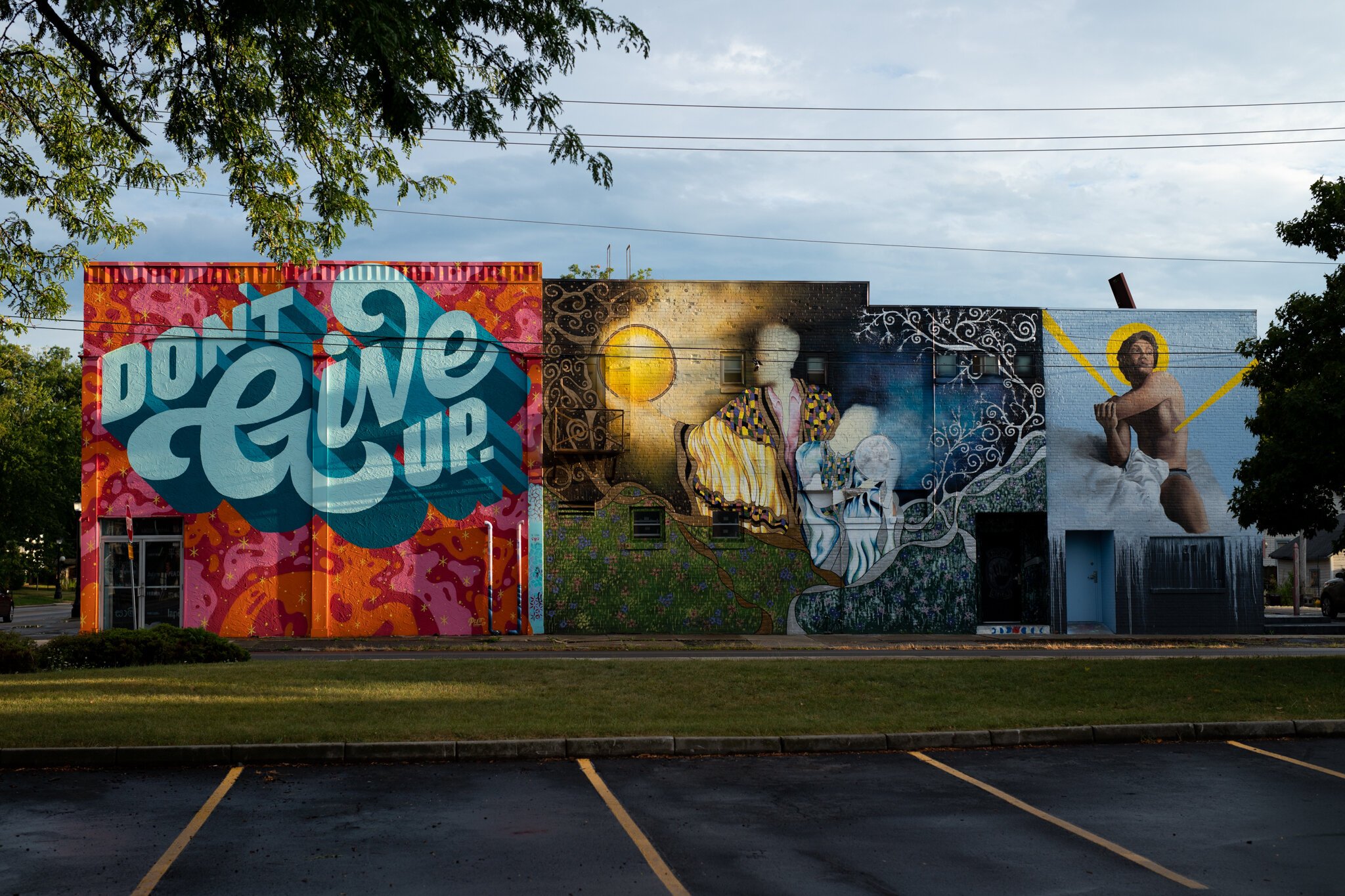 Murals on the side of Wunderkammer Company at 3402 Fairfield Ave.